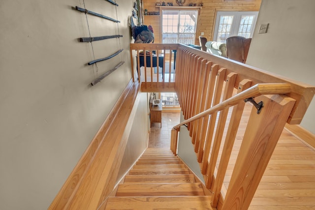 staircase with hardwood / wood-style flooring