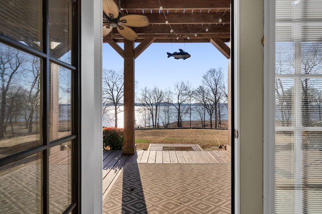 doorway to outside with ceiling fan