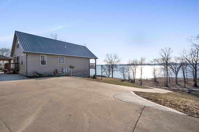 exterior space with a water view