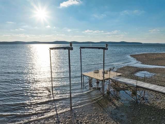 dock area featuring a water and mountain view