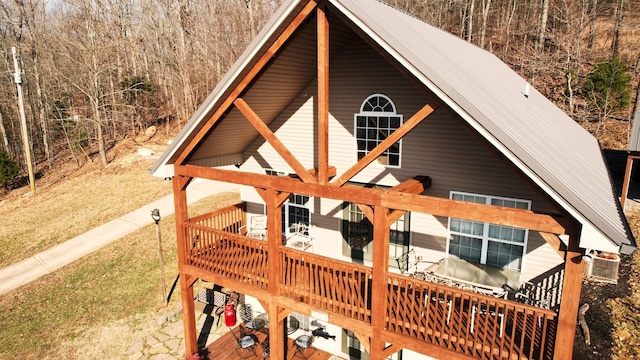 back of property with a wooden deck