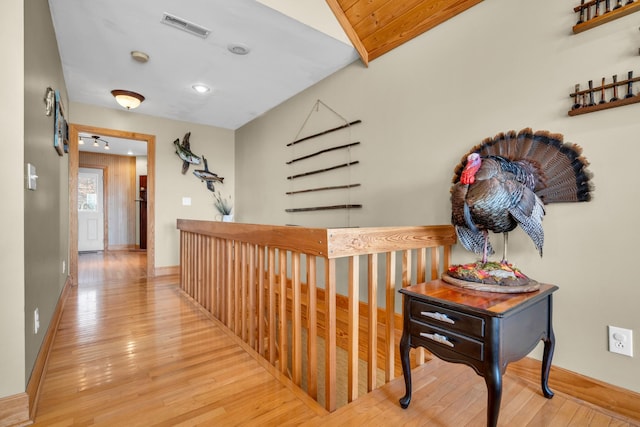 corridor featuring hardwood / wood-style floors