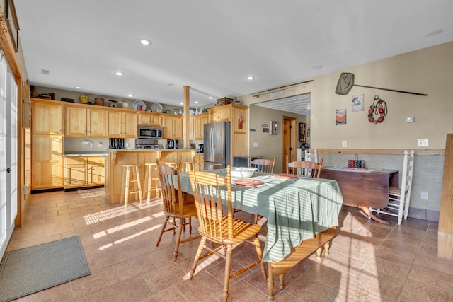 dining area featuring light tile patterned floors