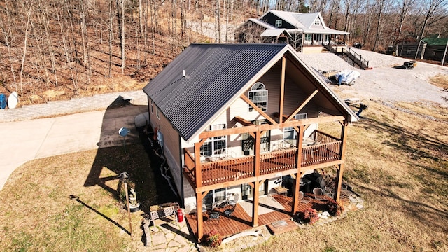 rear view of property with a wooden deck