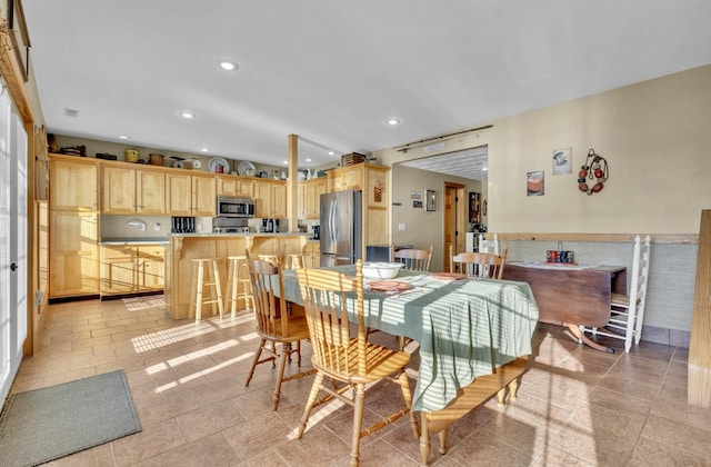 dining room featuring recessed lighting