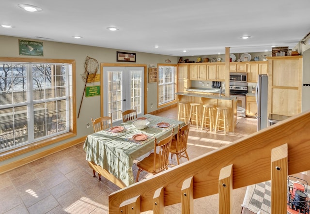 dining room with recessed lighting, baseboards, and french doors