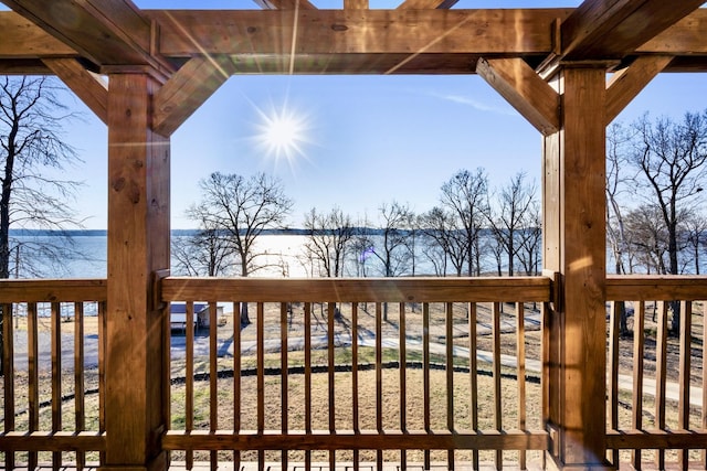 wooden deck with a water view