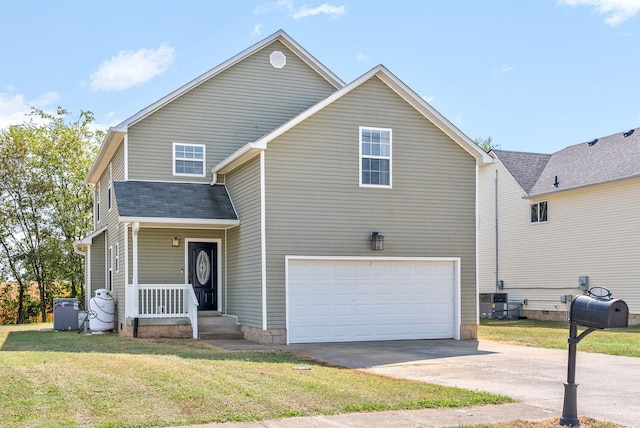 view of property with a front lawn and a garage