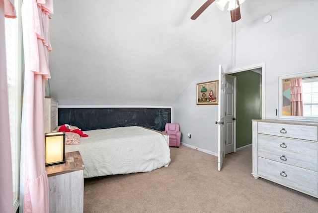 carpeted bedroom with ceiling fan and lofted ceiling