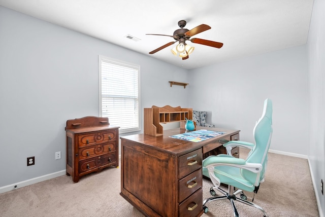 home office featuring light colored carpet and ceiling fan