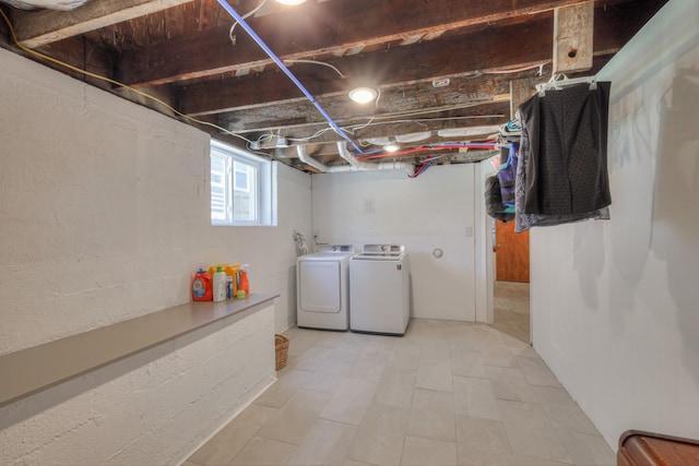 clothes washing area with independent washer and dryer