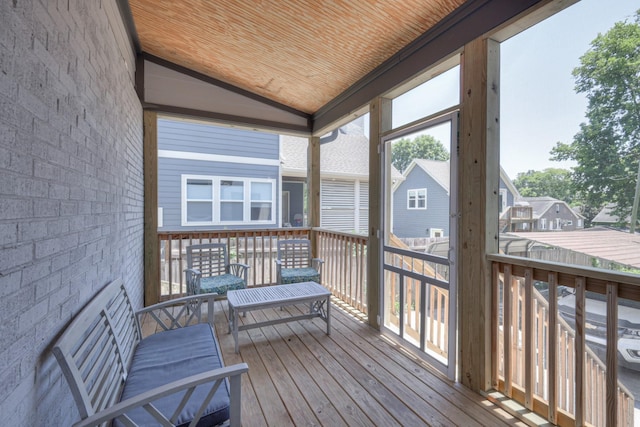 sunroom / solarium featuring wood ceiling