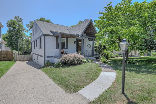 view of front of home featuring a front yard and a garage