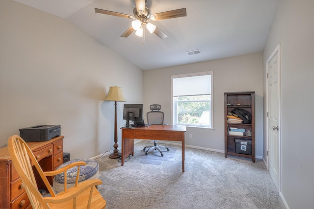 carpeted home office featuring ceiling fan and vaulted ceiling