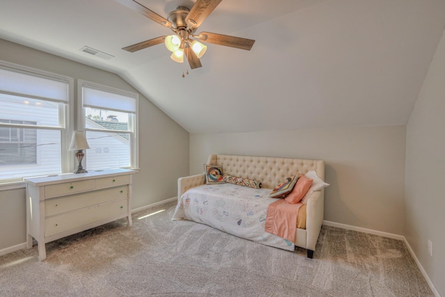 carpeted bedroom featuring vaulted ceiling and ceiling fan