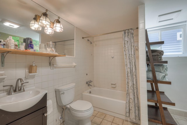 full bathroom featuring shower / bath combo, vanity, tile walls, tile patterned flooring, and toilet