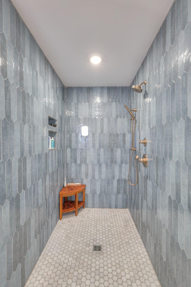 bathroom with tiled shower