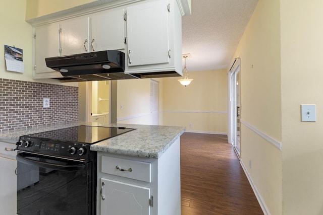 kitchen featuring tasteful backsplash, dark hardwood / wood-style flooring, black electric range, decorative light fixtures, and white cabinets