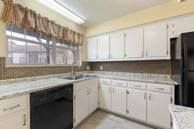 kitchen with white cabinetry, sink, a textured ceiling, decorative backsplash, and black appliances