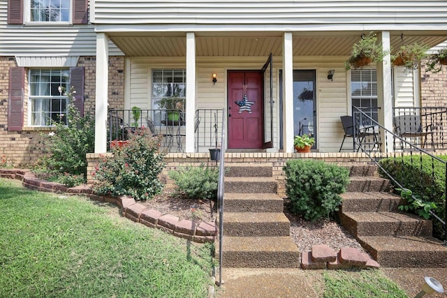 view of exterior entry featuring a porch