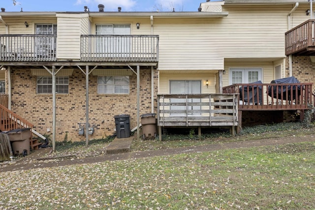 back of house featuring a wooden deck