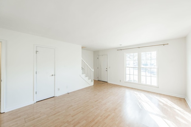 spare room featuring light hardwood / wood-style floors