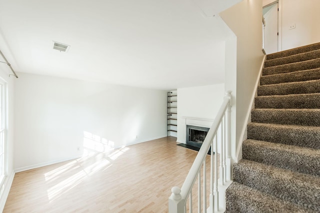 stairway featuring hardwood / wood-style flooring