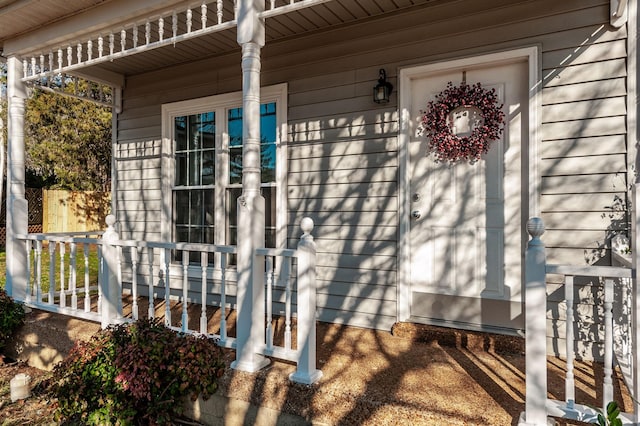 property entrance featuring a porch