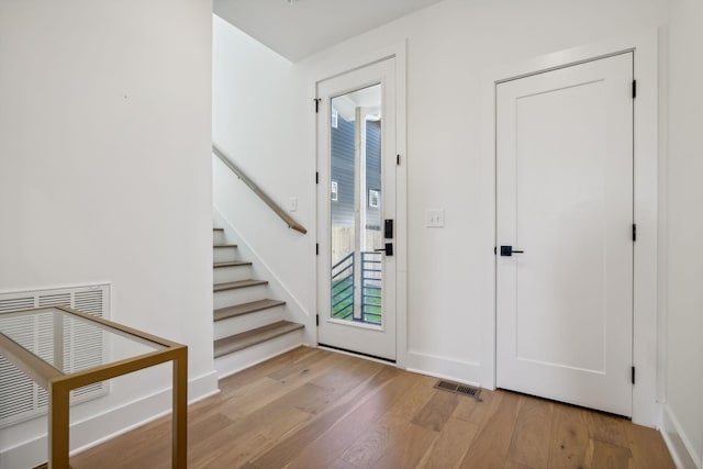 entrance foyer with light hardwood / wood-style flooring