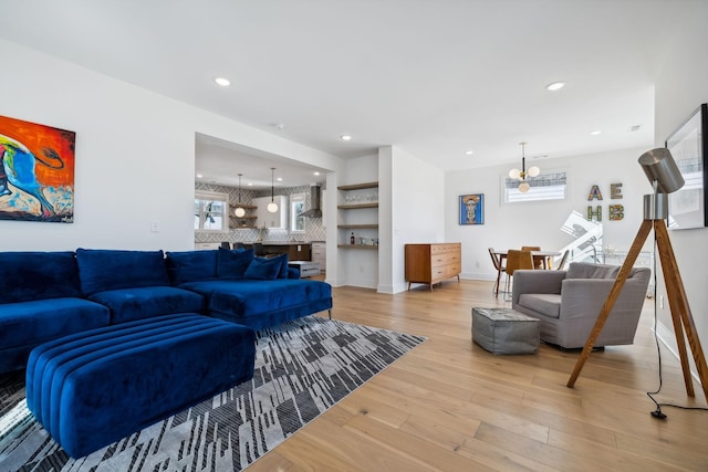 living room featuring hardwood / wood-style floors and a chandelier