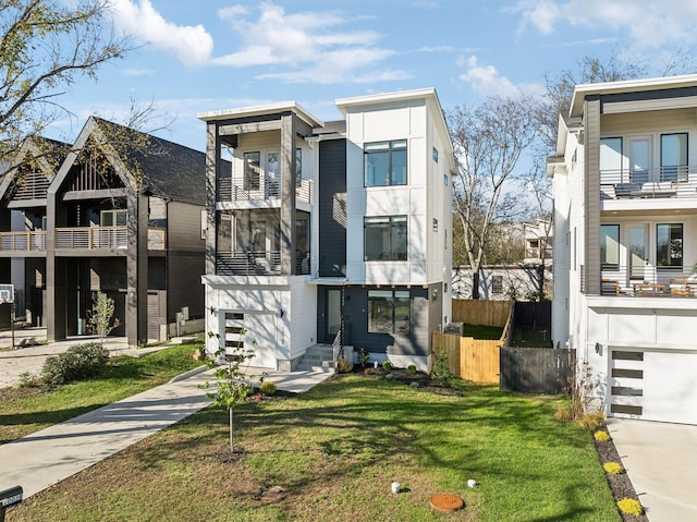 exterior space with a front yard and a garage