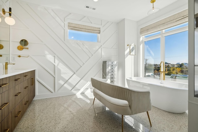 bathroom featuring a bathing tub and vanity