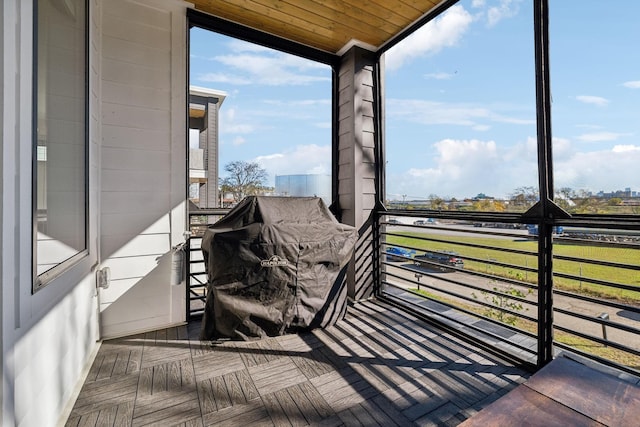 sunroom / solarium with wooden ceiling and a wealth of natural light