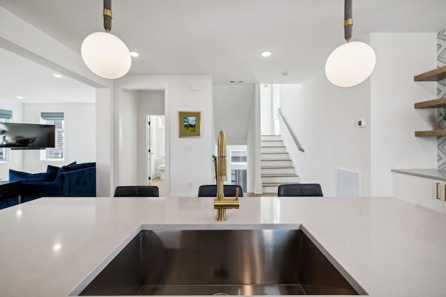 kitchen featuring pendant lighting and sink