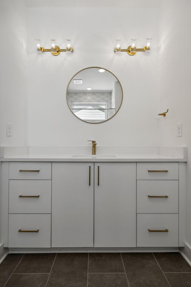 bathroom with tile patterned flooring and vanity