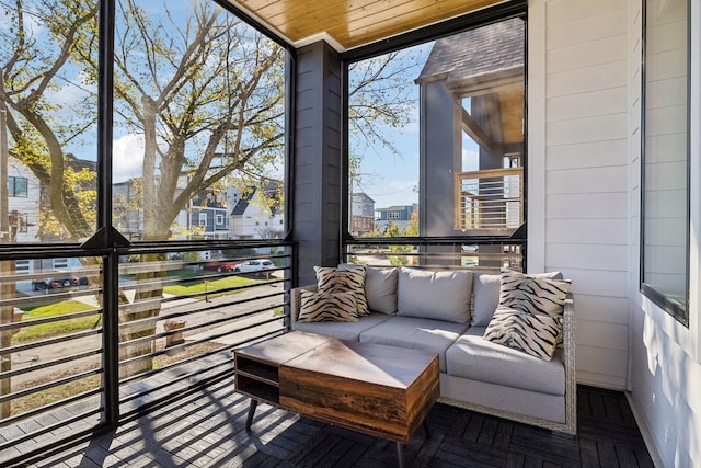 sunroom featuring wooden ceiling