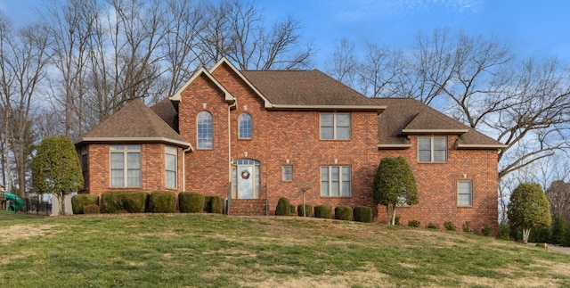 view of front of home with a front lawn