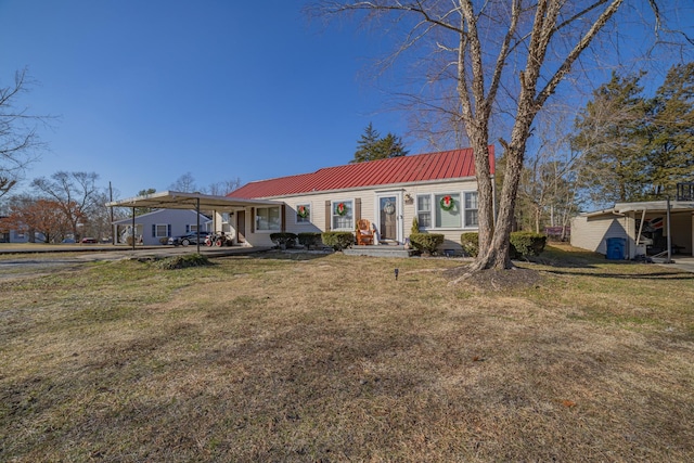 ranch-style house featuring a front yard and a carport