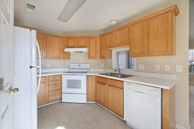 kitchen featuring white appliances and sink