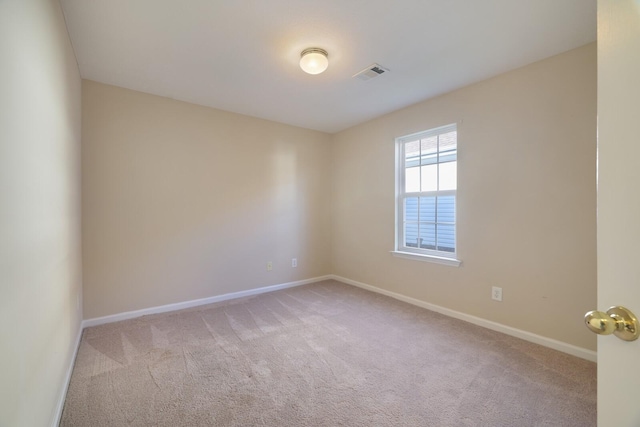 empty room featuring light carpet