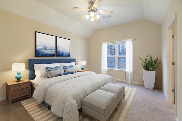 bedroom featuring ceiling fan, light carpet, and vaulted ceiling