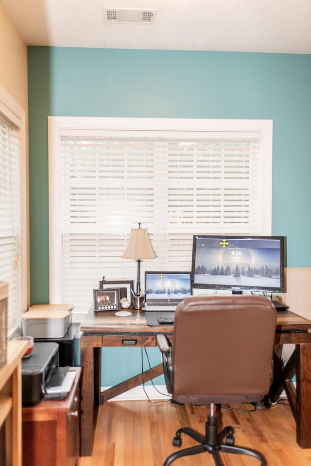 office space featuring light hardwood / wood-style floors