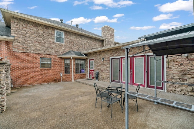 back of house with a patio area