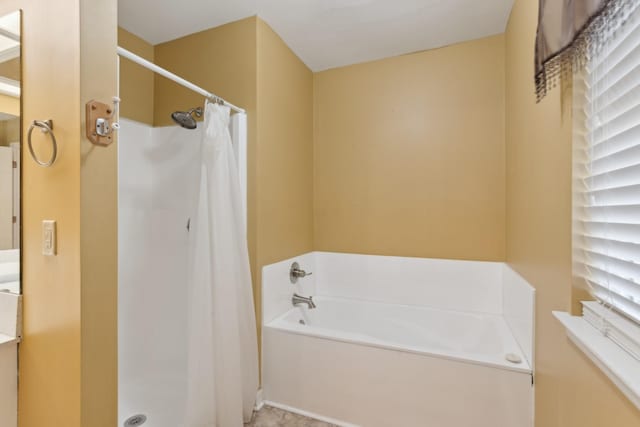 bathroom with separate shower and tub