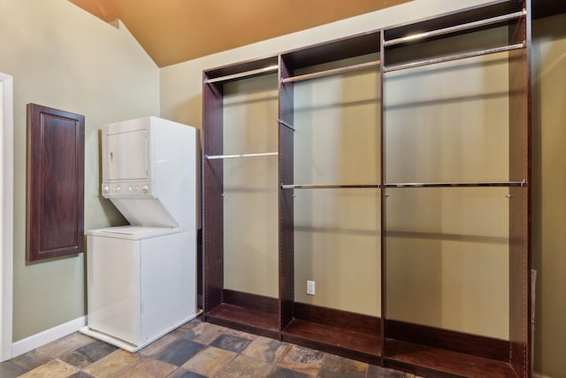 laundry room with stacked washer and dryer