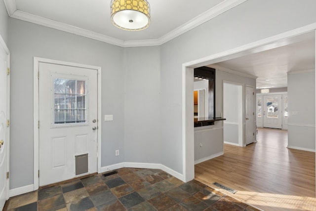 entrance foyer featuring crown molding