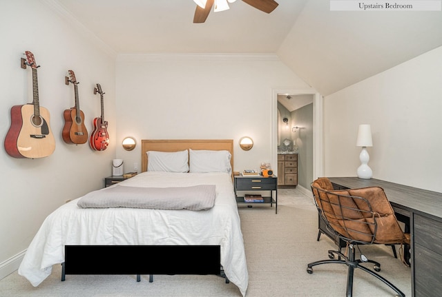 carpeted bedroom featuring lofted ceiling, ensuite bathroom, ceiling fan, and crown molding