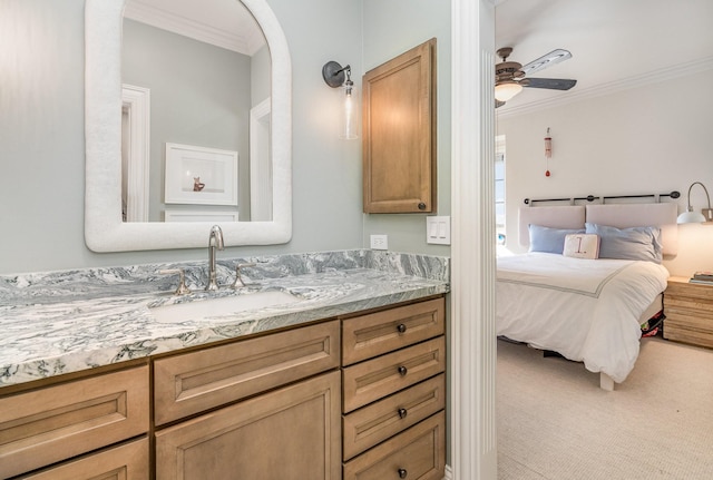 bathroom with ceiling fan, crown molding, and vanity