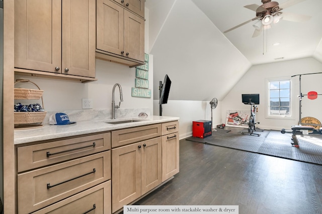 kitchen with sink, vaulted ceiling, light brown cabinets, ceiling fan, and dark hardwood / wood-style floors