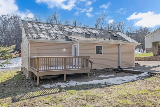 back of house featuring a deck